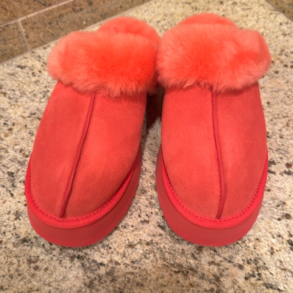 UGG woman’s slipper. Size 8. Coral/ Red color.
